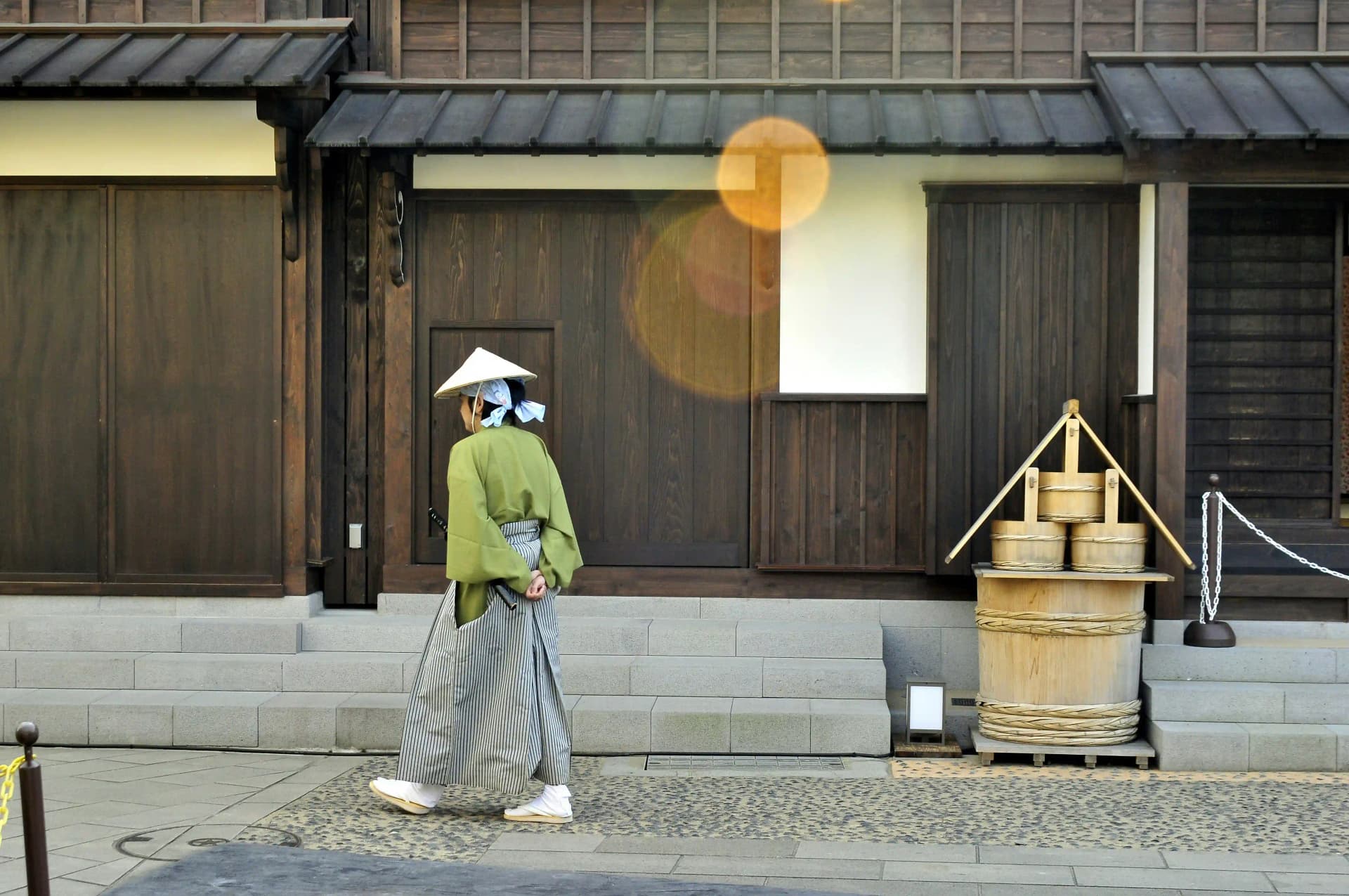 Guard in traditional Japanese attire in front of Dejima